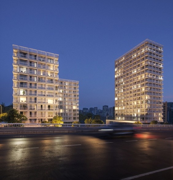Architectural render of two modern residential towers at dusk on the edge of Lisbon
